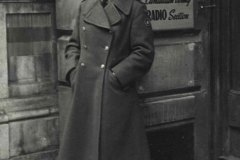 Sgt. Nadine Manning posing for the camera at the entrance to the Canadian Army Film Unit, 28 Pall Mall, London, England. Nadine Manning Collection.