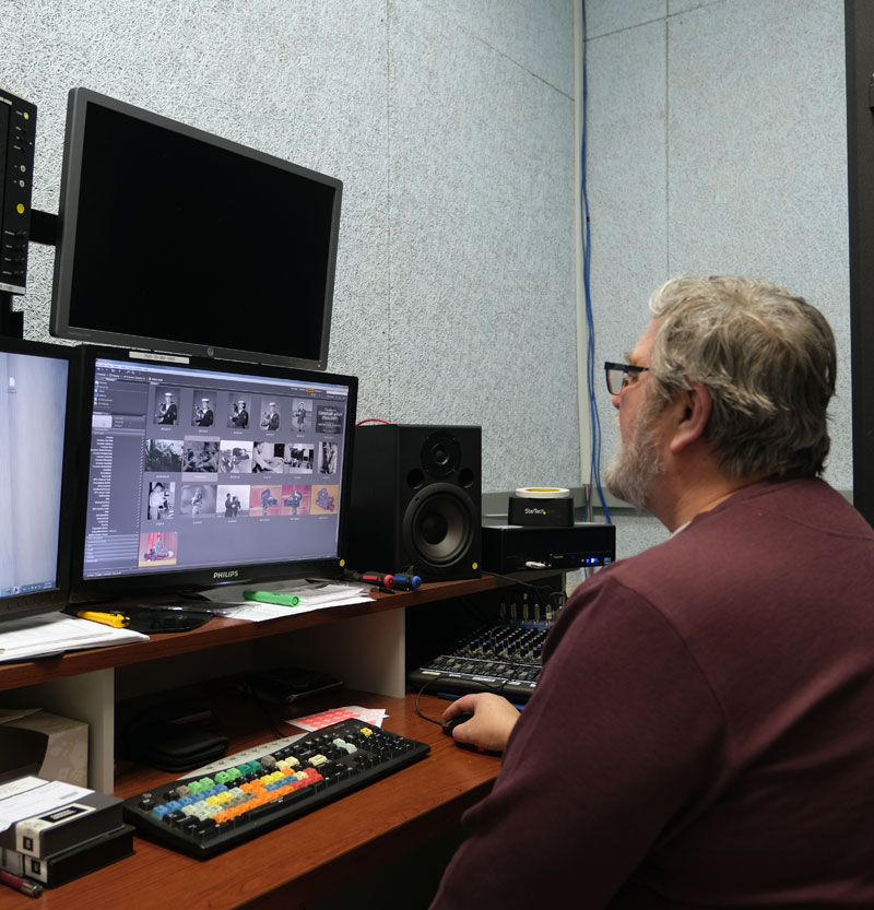 Archivist Yves Gemus works on historical video products held in the National Defence Imagery Library at the Operational and Technical Imagery Centre (OPTIC) at building M-23 in Ottawa, Ontario on 28 January 2020.