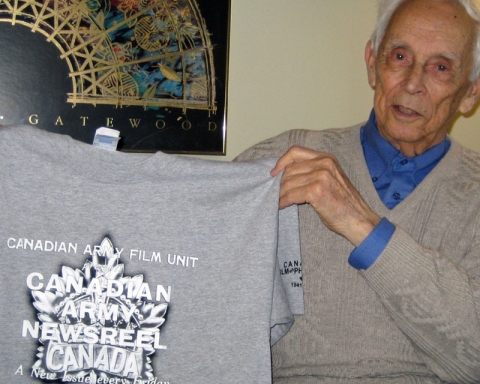 Graham posing with a signed CAFU Newsreel t-shirt, May 2008, where I first interviewed him at his home in Richmond Hill, Ontario.